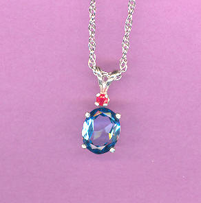 Silver w/ 2.3ct  9x7mm Oval  SWISS BLUE TOPAZ w/2mm RUBY Accent  On 18" S/S Chain