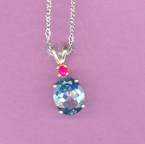 Silver w/ 3.4ct  10x8 mm Oval Deep SWISS BLUE TOPAZ accented by a .09ct RUBY On 18"S/S Chain