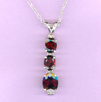 Silver 3 Stone GANET  Pendant featuring: 2-8x6mm, 1.4ct,  and 1-10x8mm 3.2ct GARNETS on an 18" Silver Chain